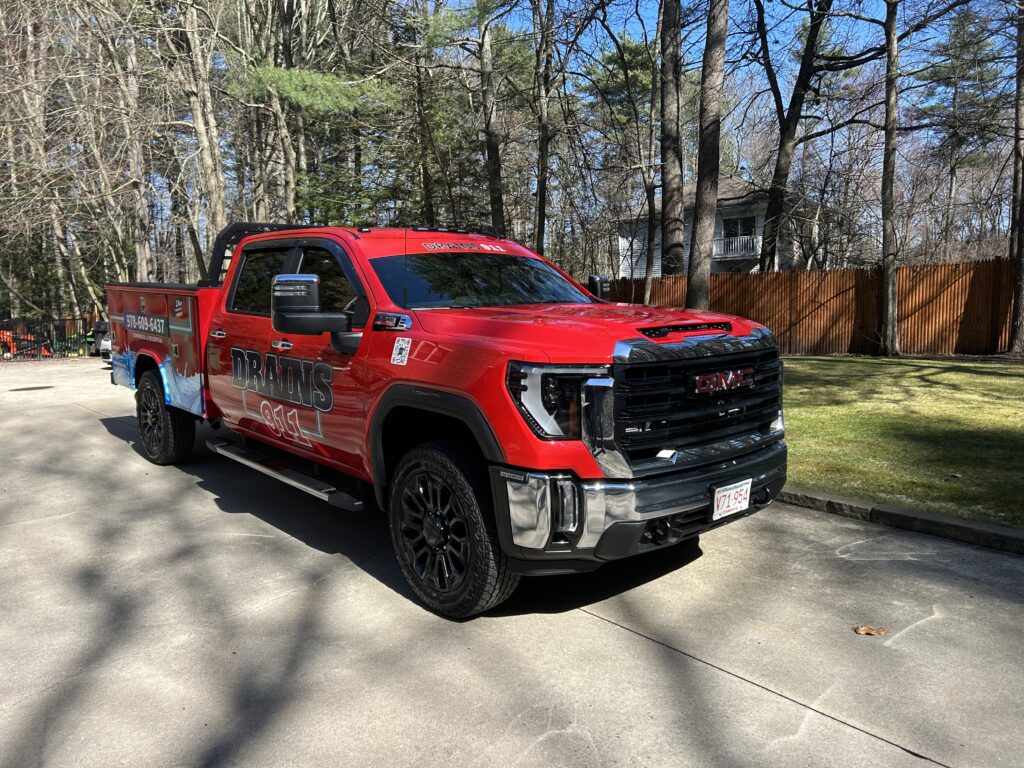 drain cleaning experts in Saugus, MA in a red work vehicle.